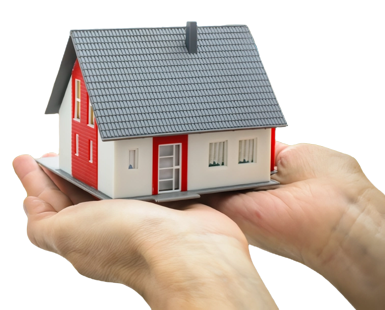 A person holding a small model house in their hands.