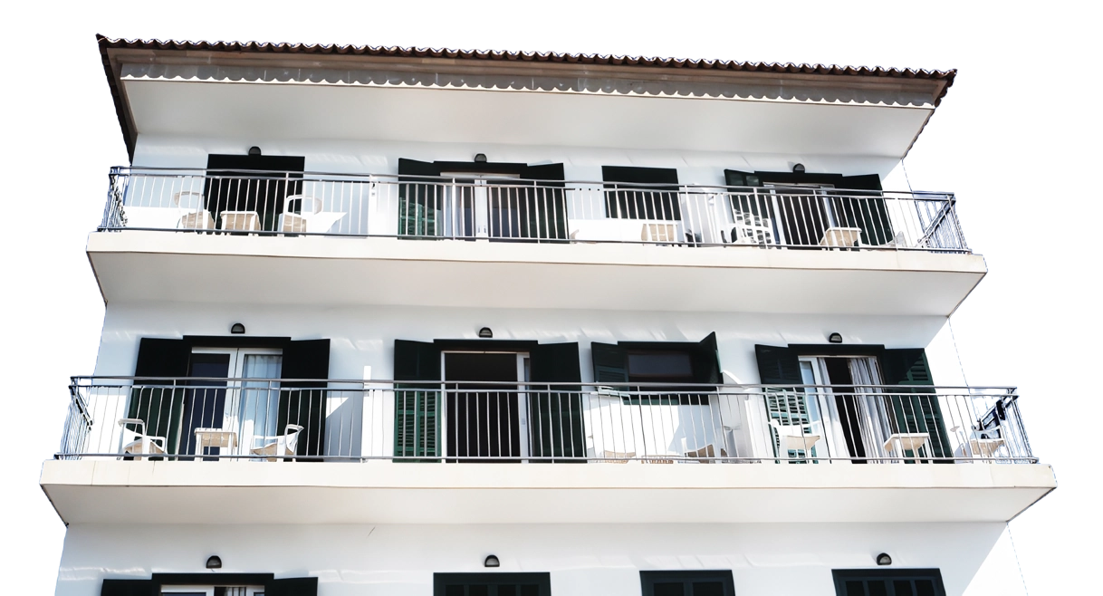 A building with many balconies and windows.